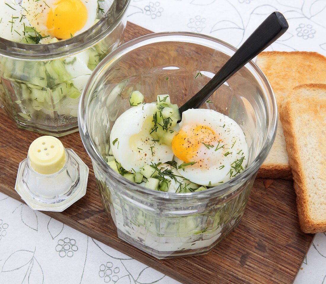 Eggs with dill gherkins in a jar