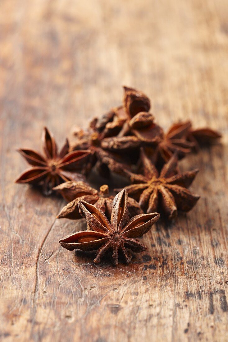 Anise stars on a wooden surface