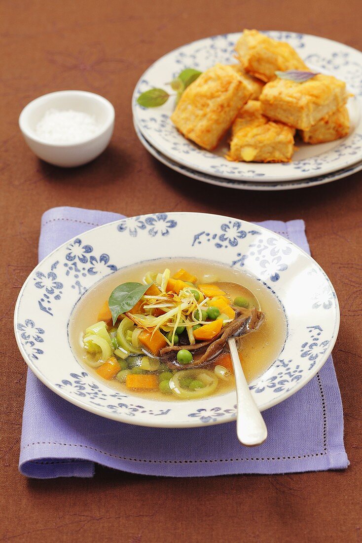 Vegetable soup with leek and peas and cheese pastries
