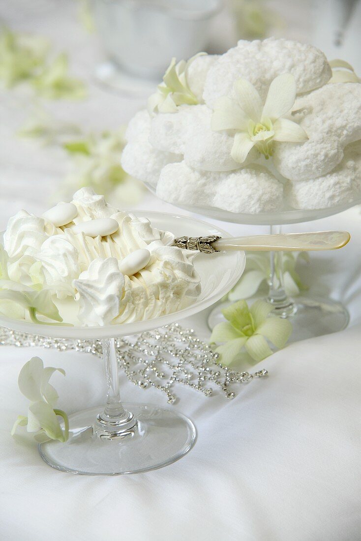Cream dessert and baked meringues on a wedding table