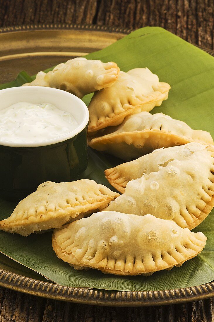 Samosas (deep-fried dough pockets filled with curried vegetables)