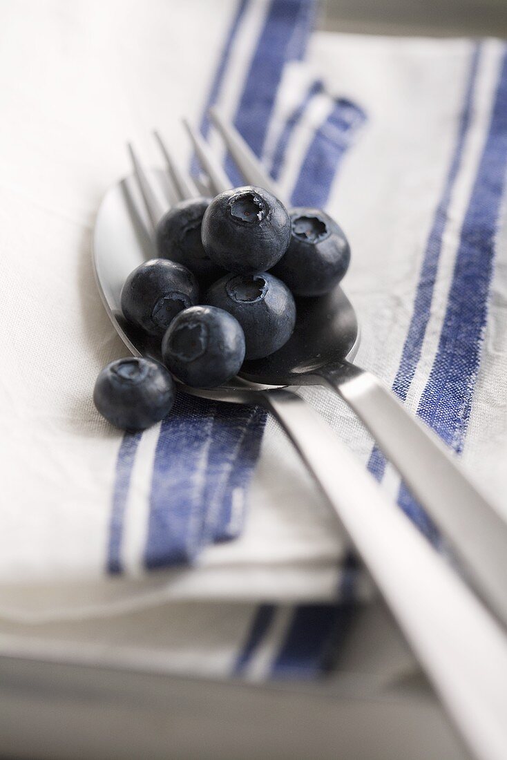 Blueberries on cutlery
