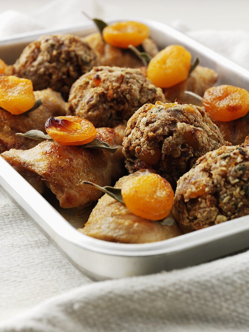 Chicken with apricots and stuffing in a roasting dish