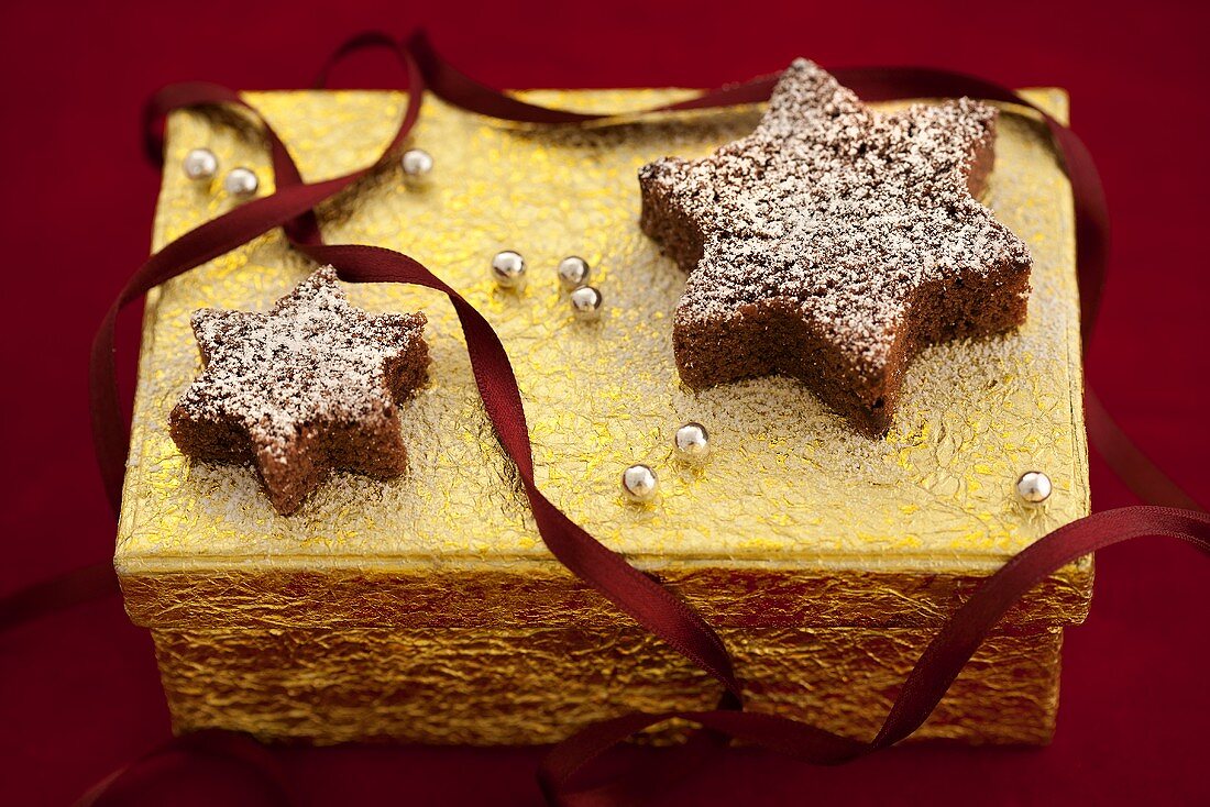 Chocolate stars on a golden gift box