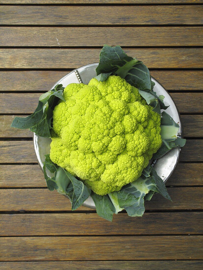 Green cauliflower on a plate, seen from above