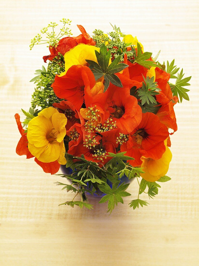 A bunch of herbs with nasturtiums