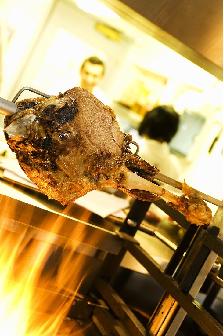 Leg of lamb on a spit in a restaurant