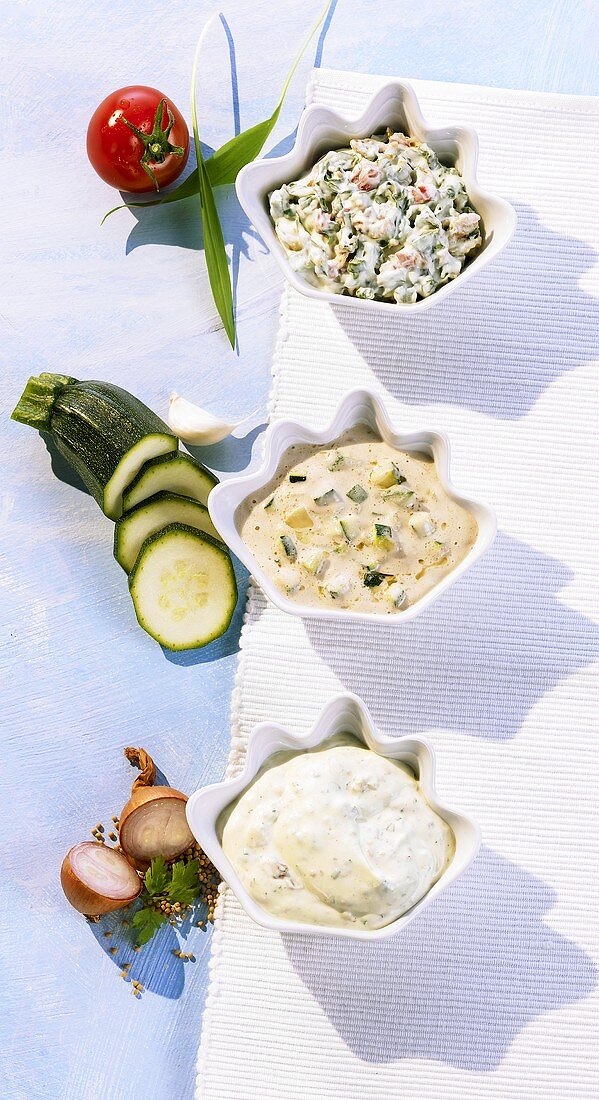 Courgette dip, pepper dip and quark dip with bacon
