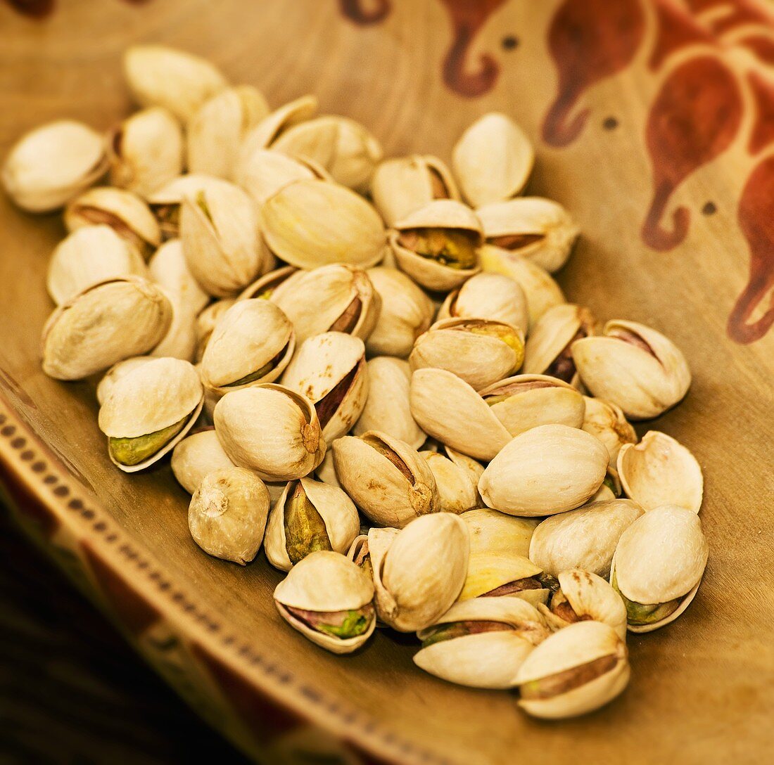 Pistachios in a wooden bowl