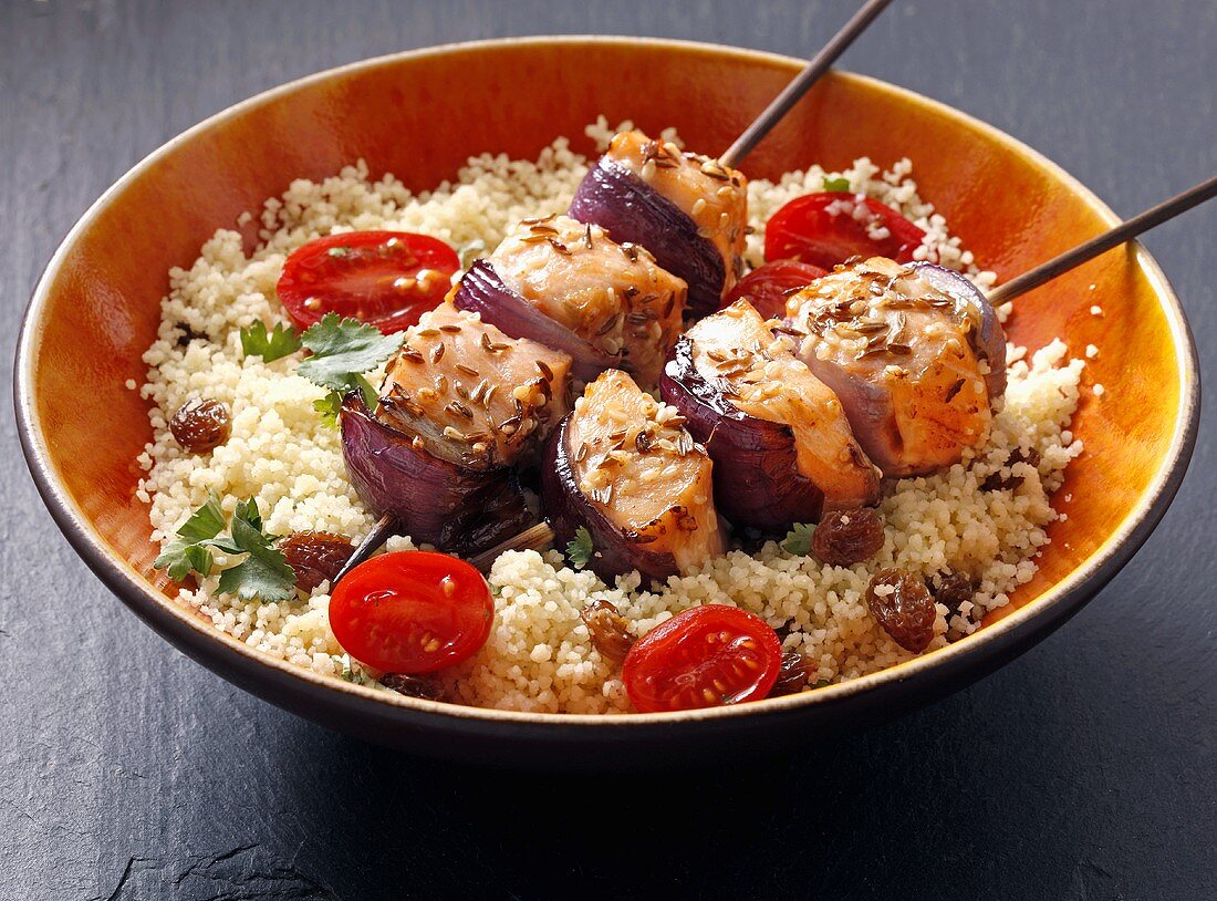 Salmon kebab with caraway on a bed of couscous