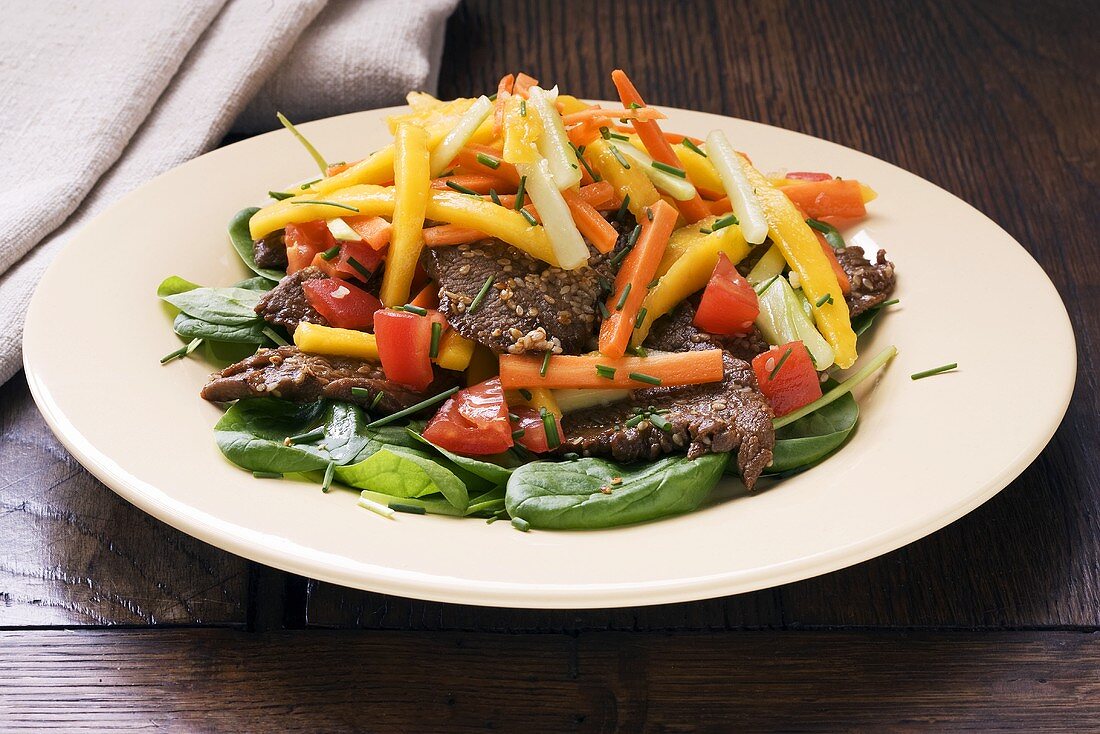 Beef with mango, vegetables and sesame