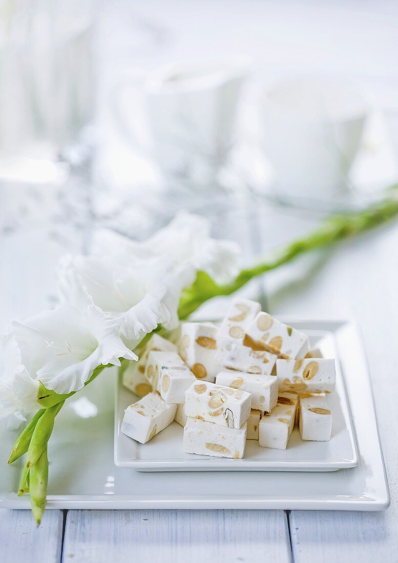 A gladiolus and white nougat with nuts