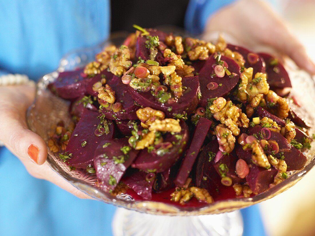 Beetroot salad with walnuts, onions and herbs