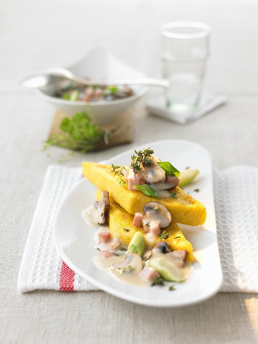 Cheese polenta with mushroom and thyme sauce