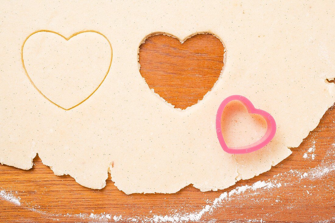 Shortbread dough with heart-shaped cutters