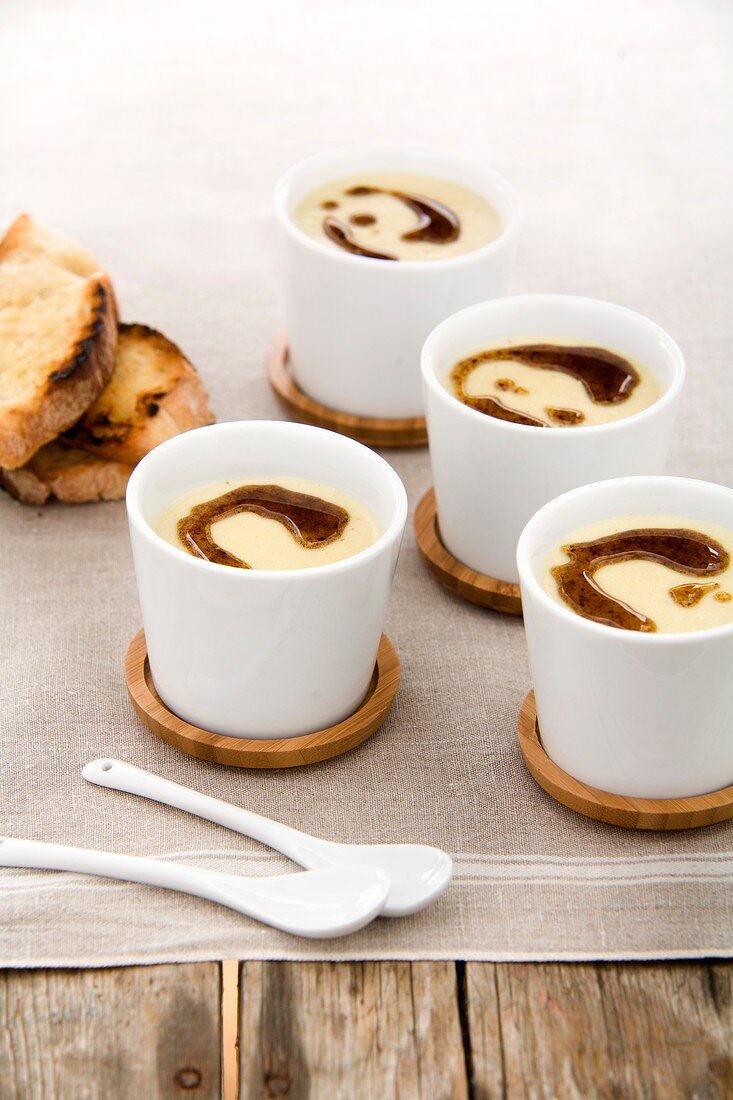 Pear and brie soup with porcini mushroom oil