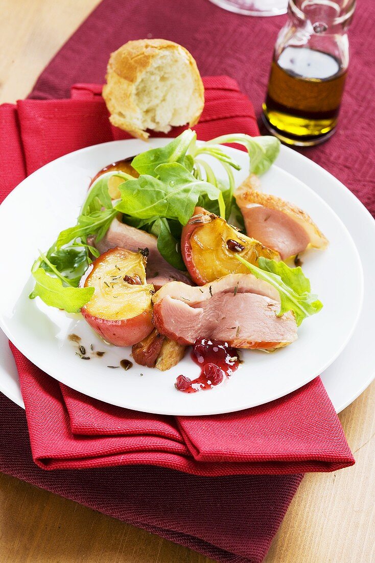 Spicy salad with spiced baked apple and smoked goose breast