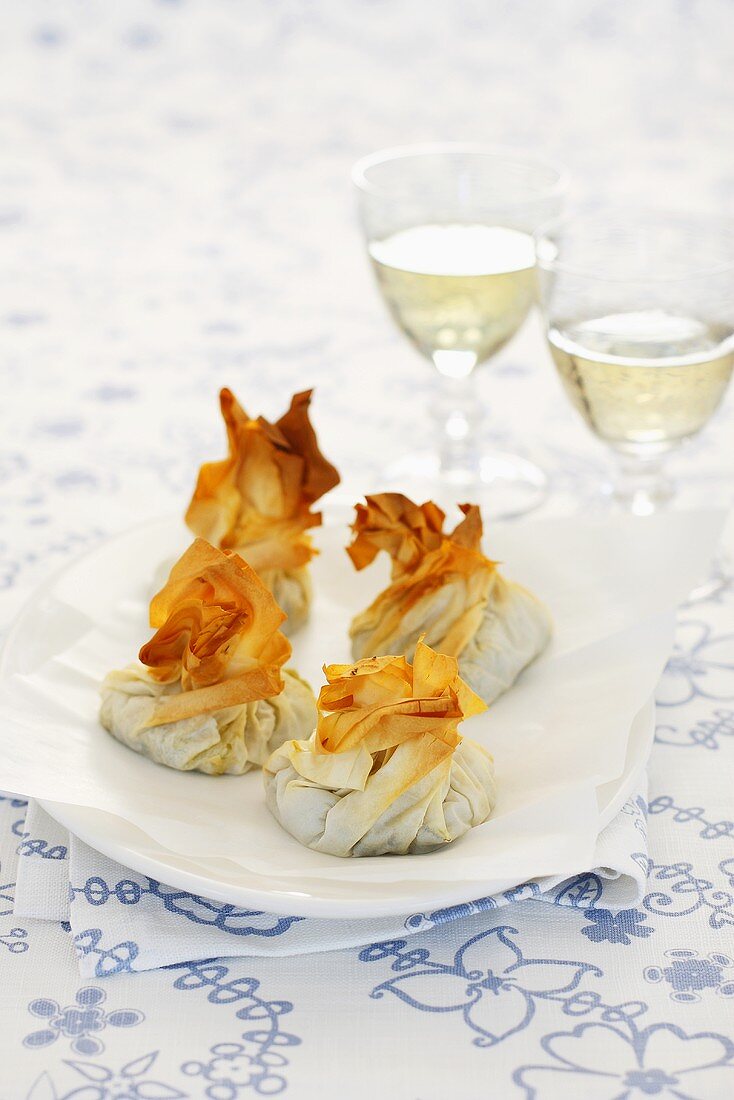 Puff pastry parcels filled with spinach and feta