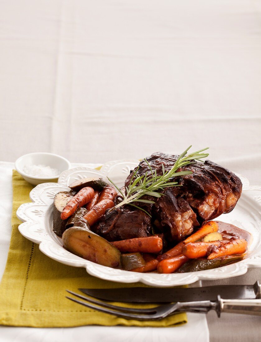 Roasted leg of lamb with rosemary and vegetables