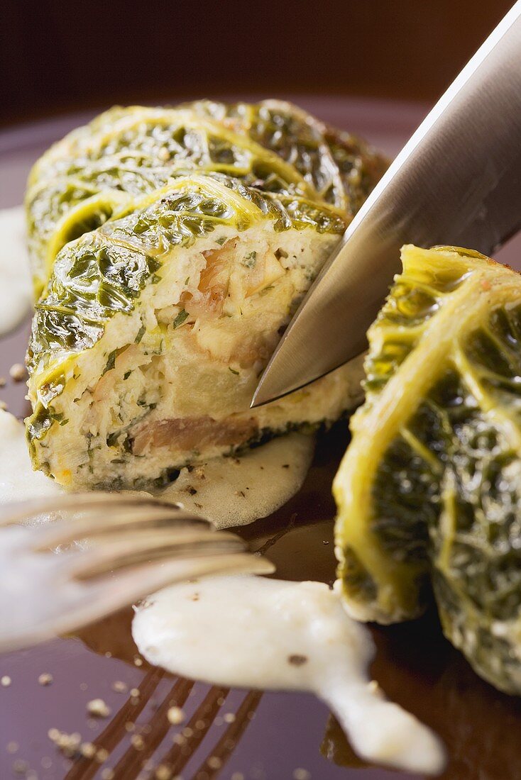 Savoy cabbage roulade filled with chestnuts and ricotta