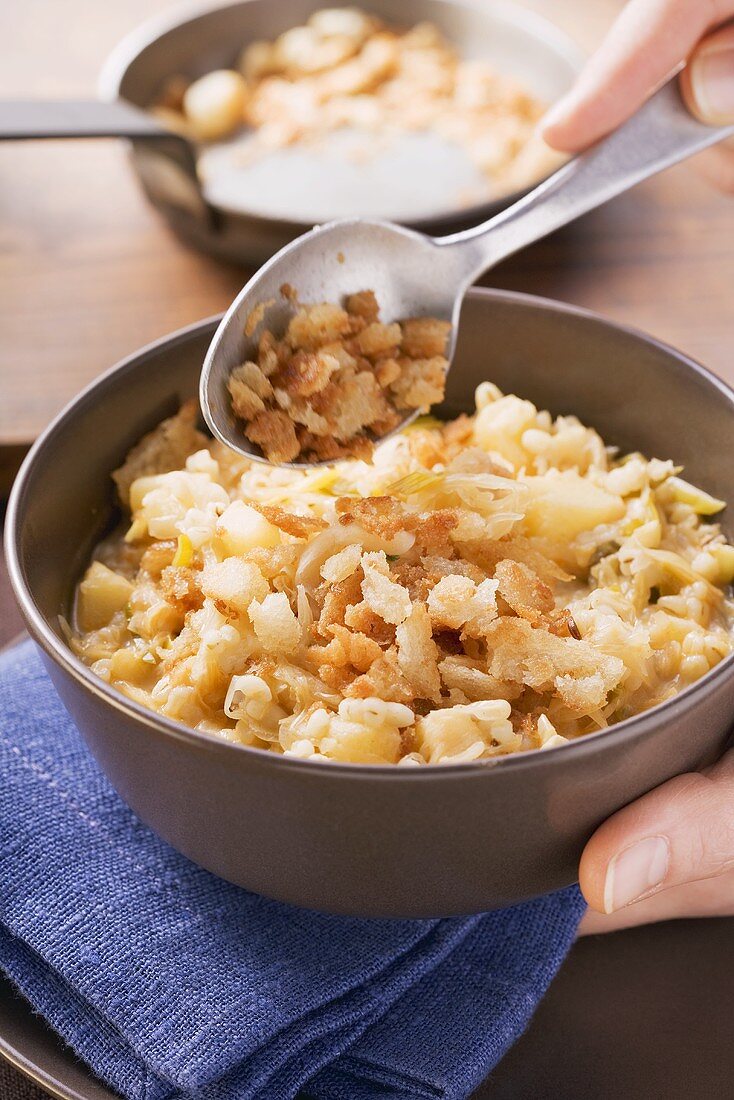 Sauerkraut with barley and croutons