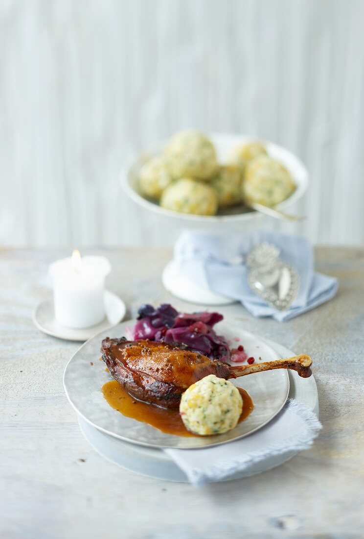 Goose leg braised in malt beer with red cabbage and bread dumplings