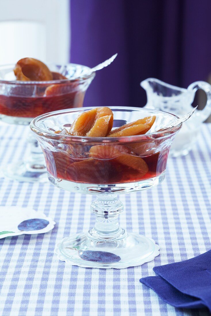 Plum compote in glass bowls