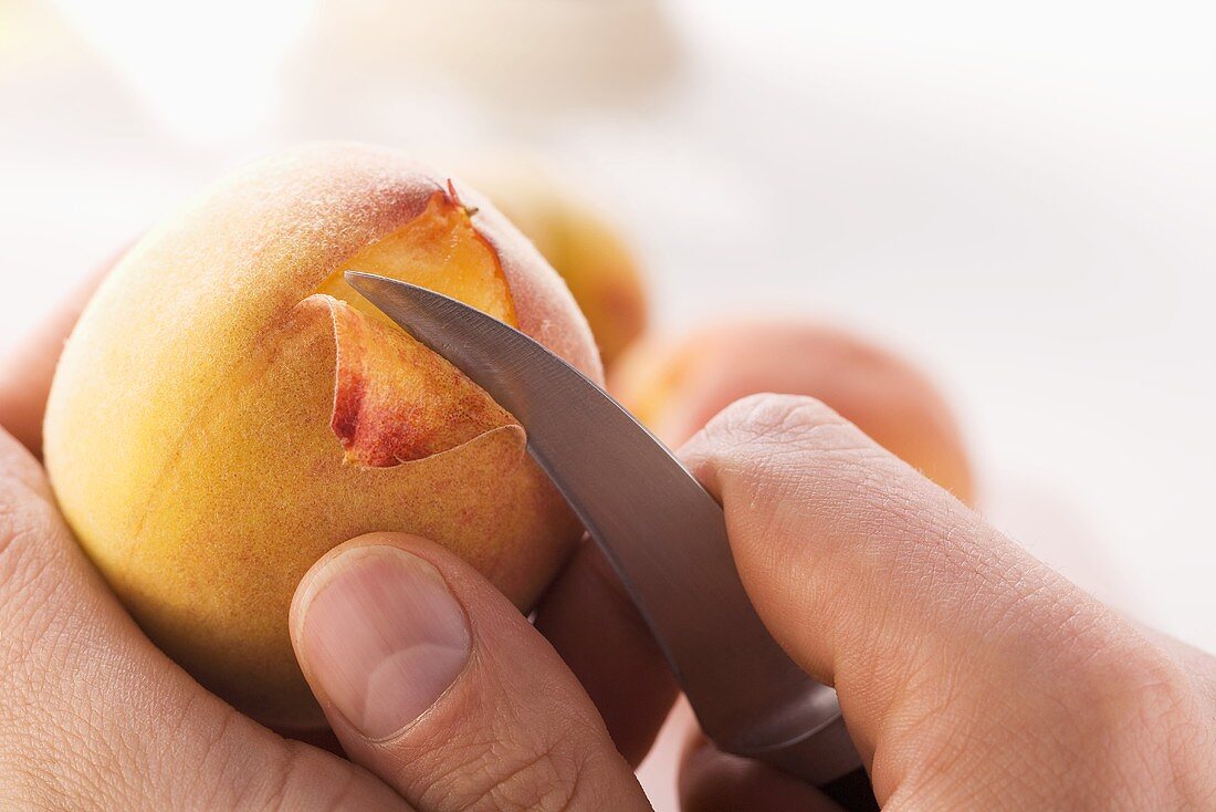 A peach being peeled