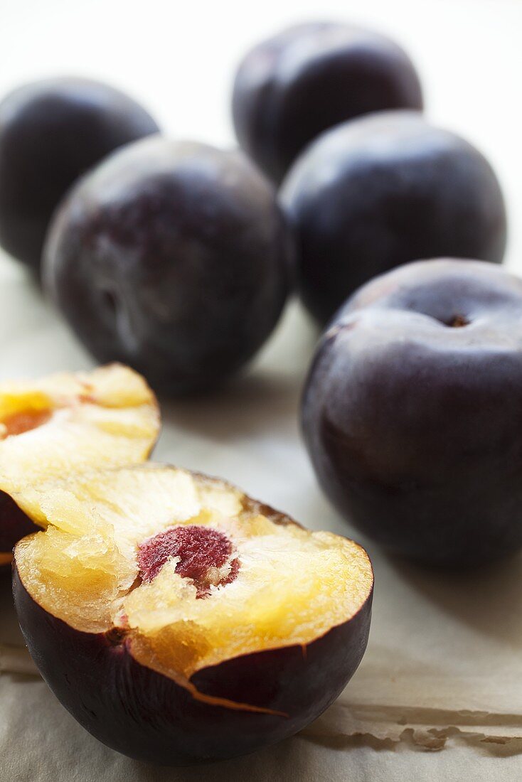 Plums, whole and halved