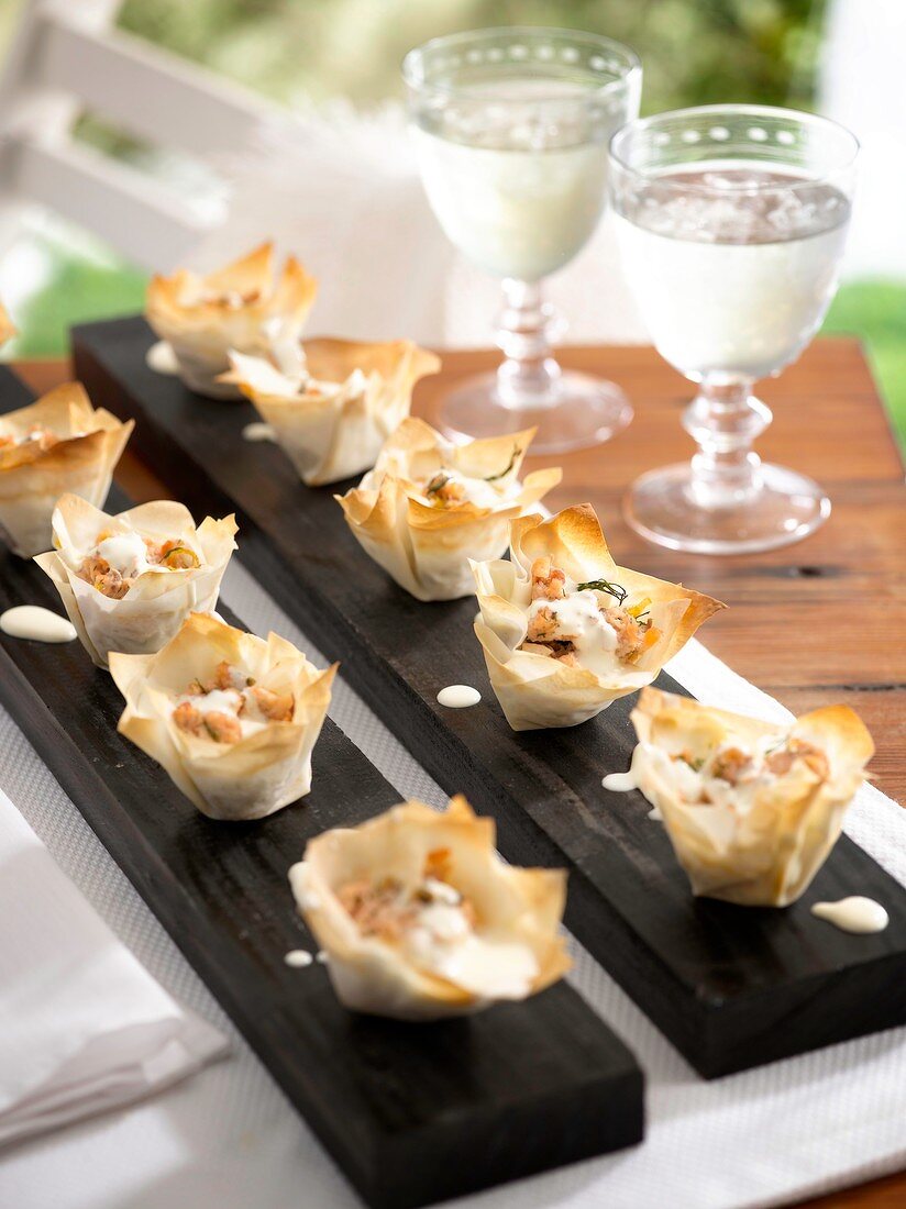 Puff pastry cases filled with salmon, capers and dill