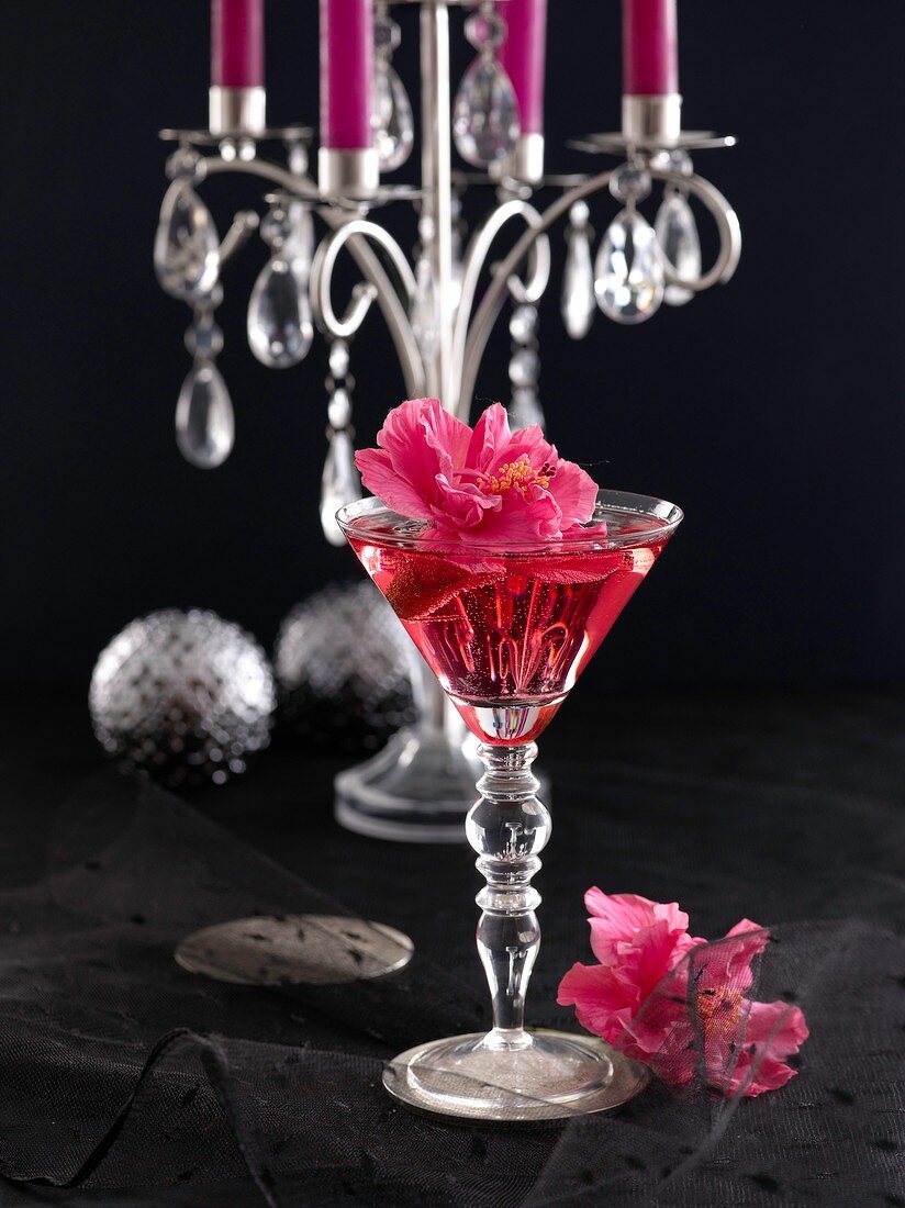 Champagne cocktail with hibiscus flowers