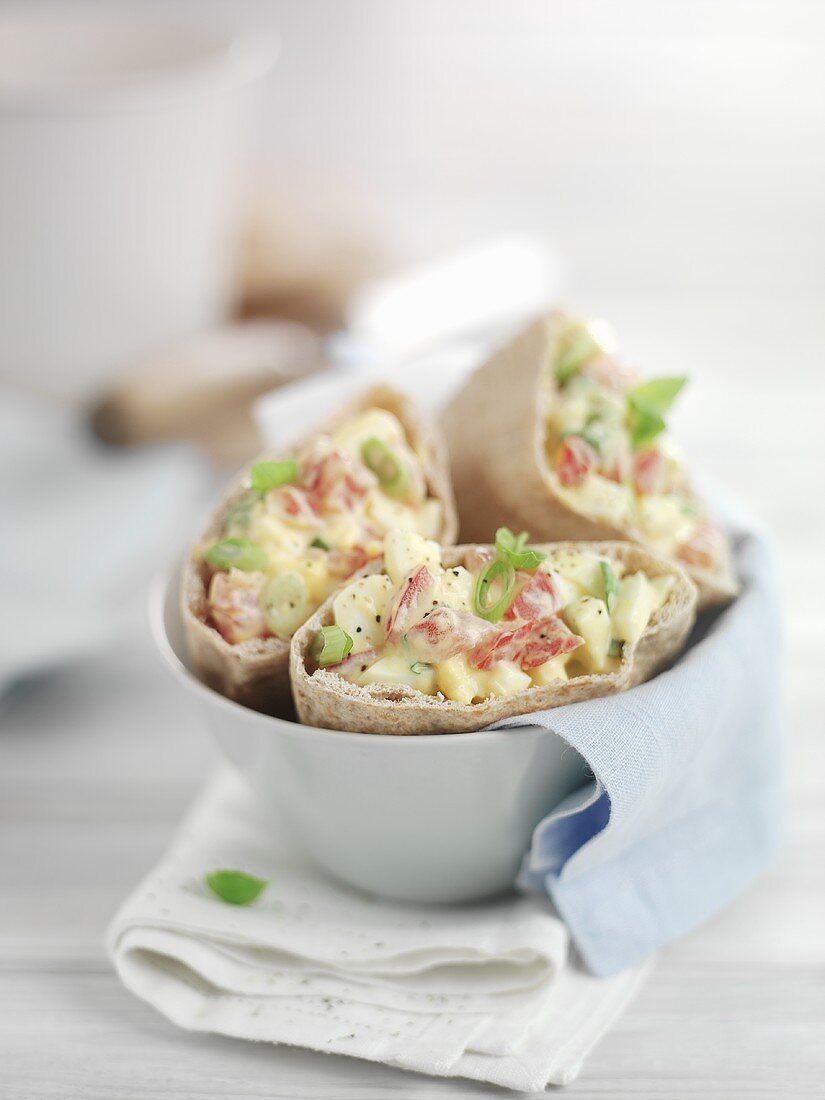 Flatbread filled with egg and tomato salad