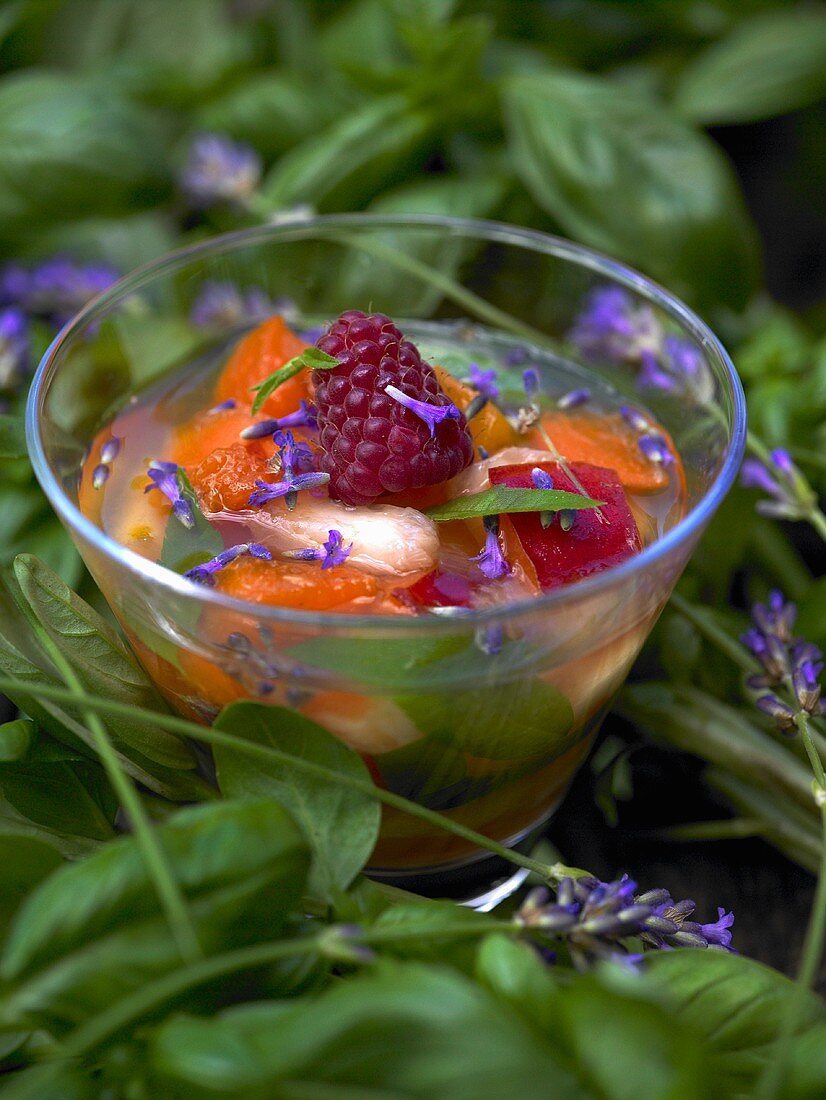 Fruit soup with flowers in glass
