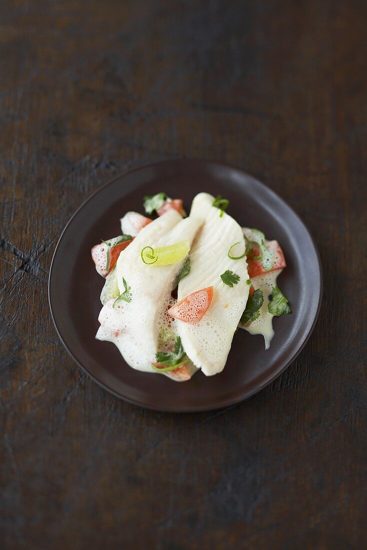 Poached John Dory with tomatoes, coriander, lime foam