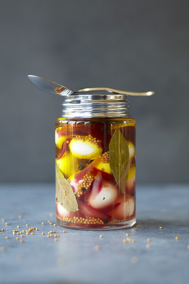 Pickled quails' eggs in a jar