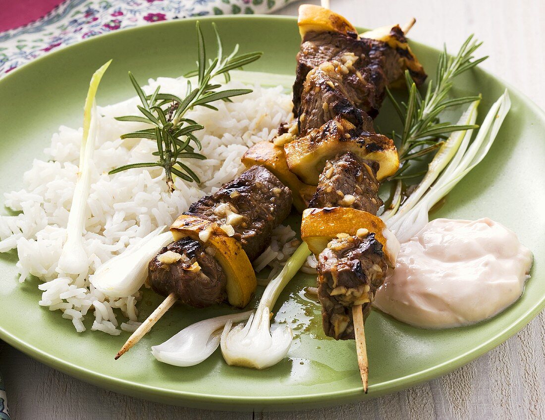 Lamb kebabs with rice and yoghurt dip