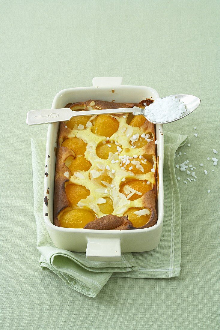 Apricot clafoutis with almonds and pearl sugar