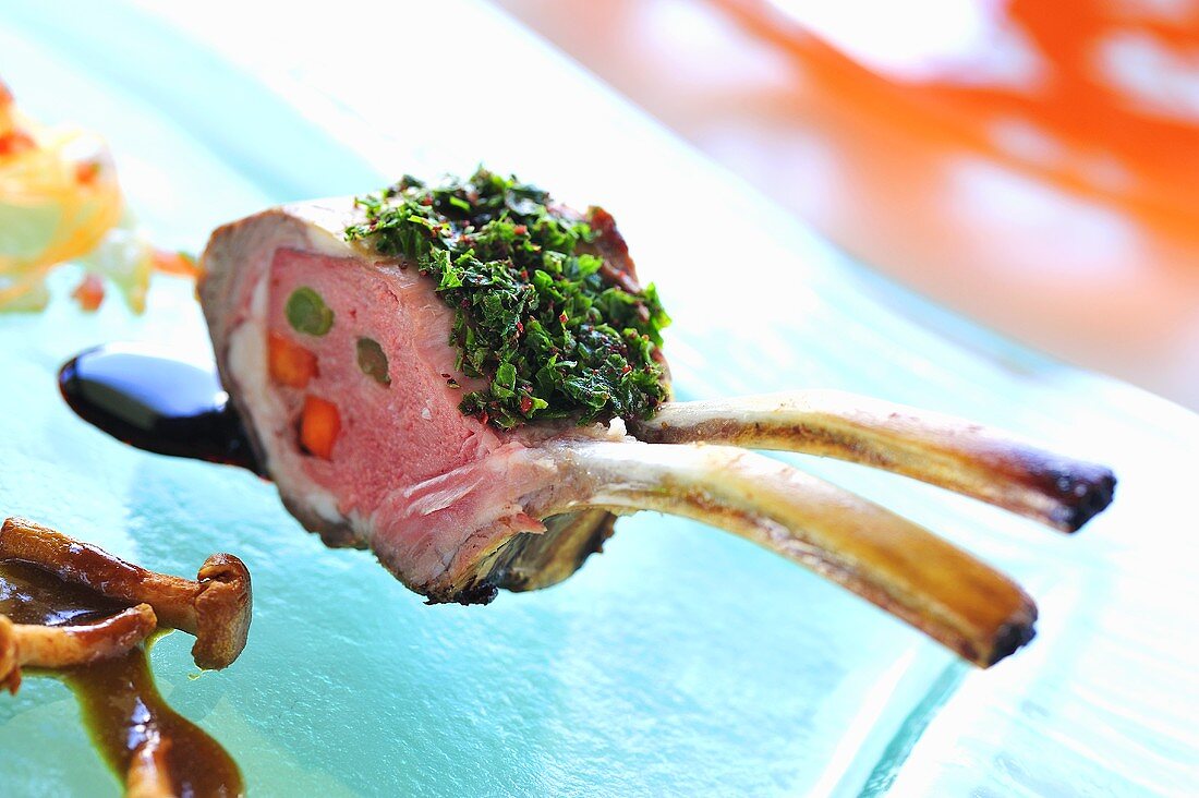 Grilled rack of lamb with herb crust and chanterelles