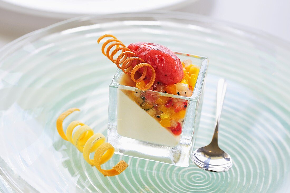 Panna cotta with exotic fruit salad and raspberry sorbet