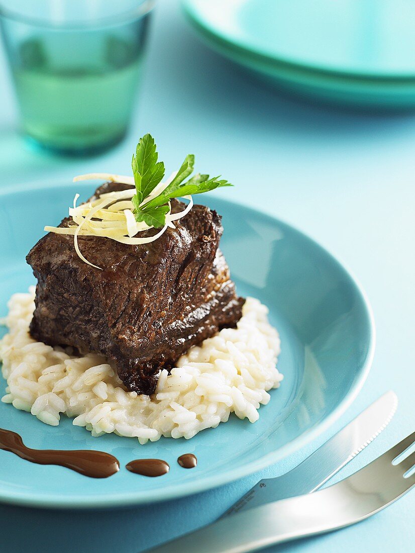 Braised beef from the rib on coconut risotto
