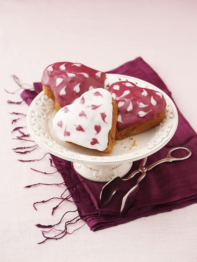 Iced, heart-shaped cherry muffins