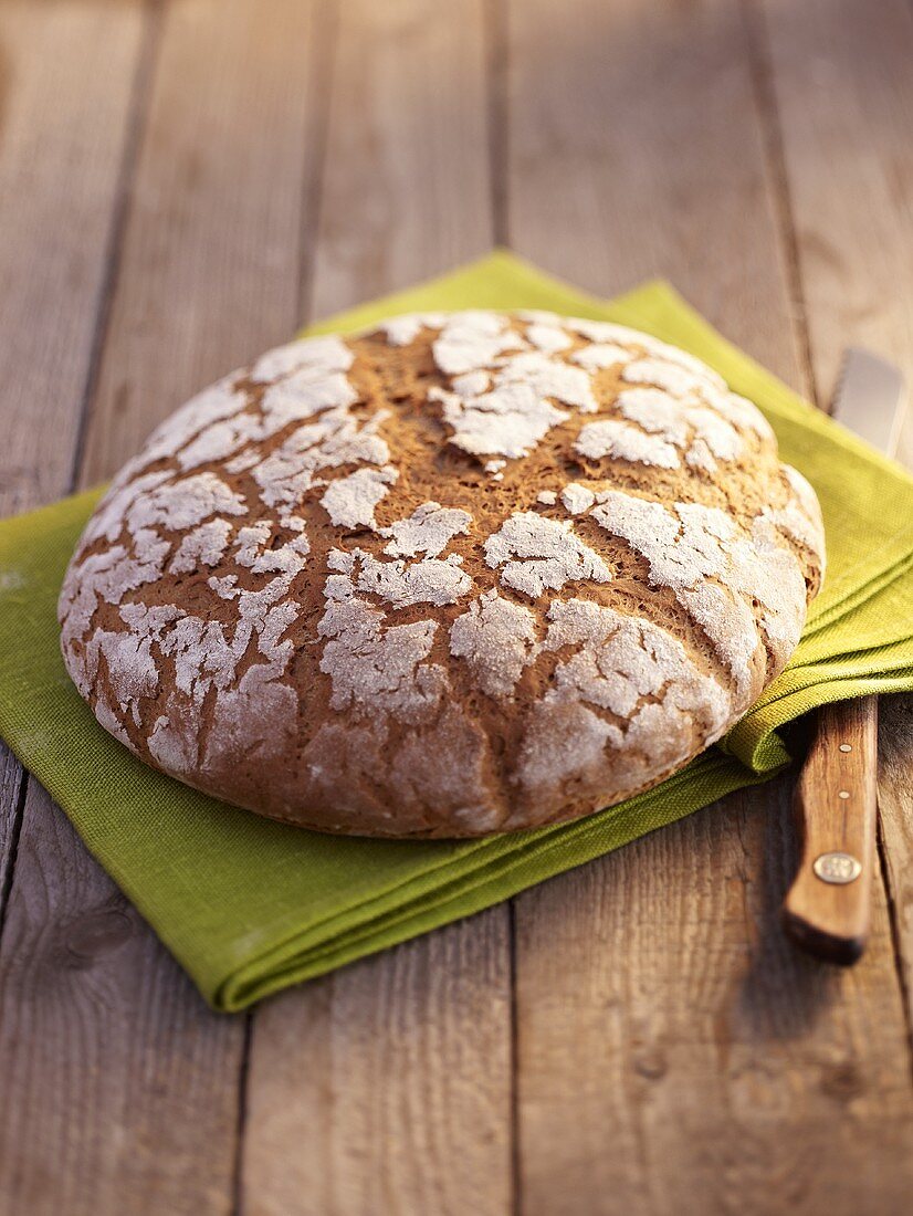 Rye bread on green linen cloth