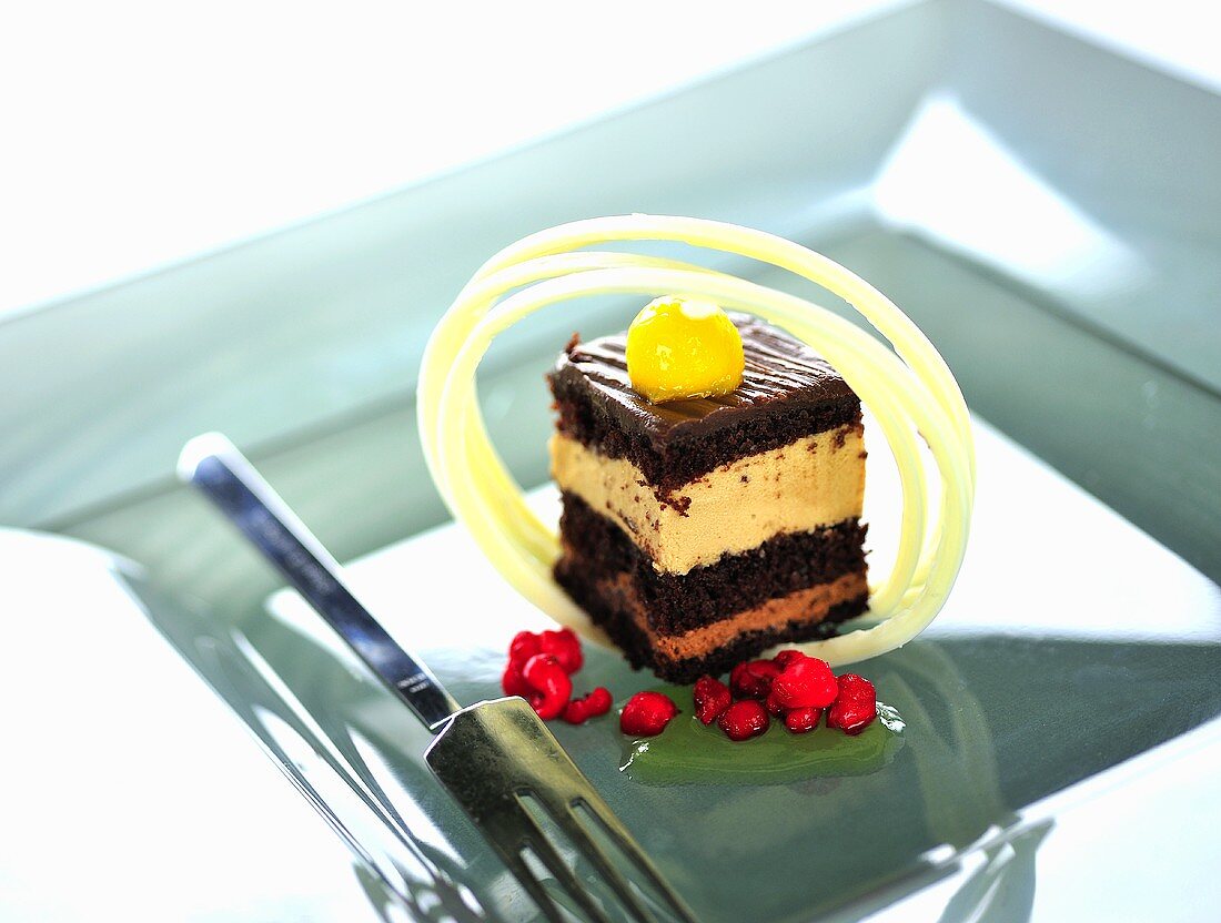 Rum chocolate cake with mango and redcurrants