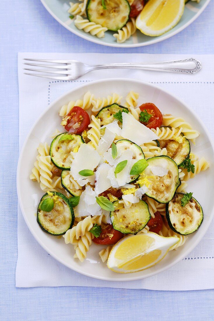 Pasta salad with courgettes, tomatoes, herbs and Parmesan