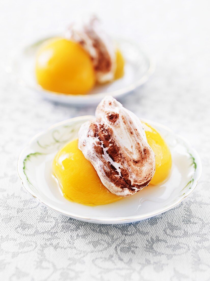 Tinned peaches with cream and cocoa powder