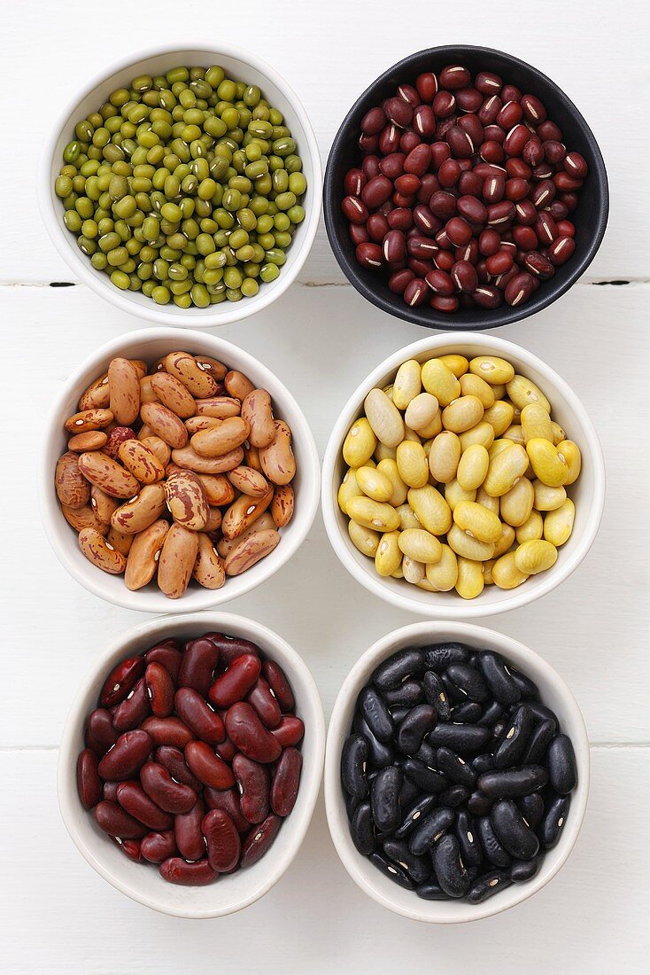 Various types of beans in small dishes