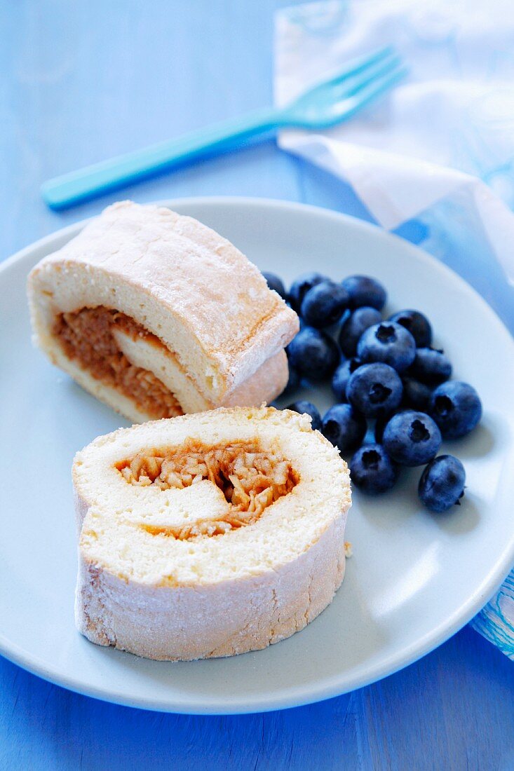 Sponge roll with apple filling and fresh blueberries