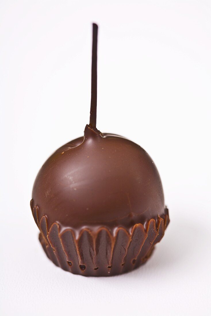A chocolate-dipped cherry