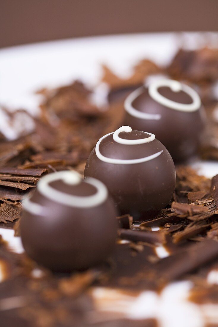 Chocolates on chocolate shavings