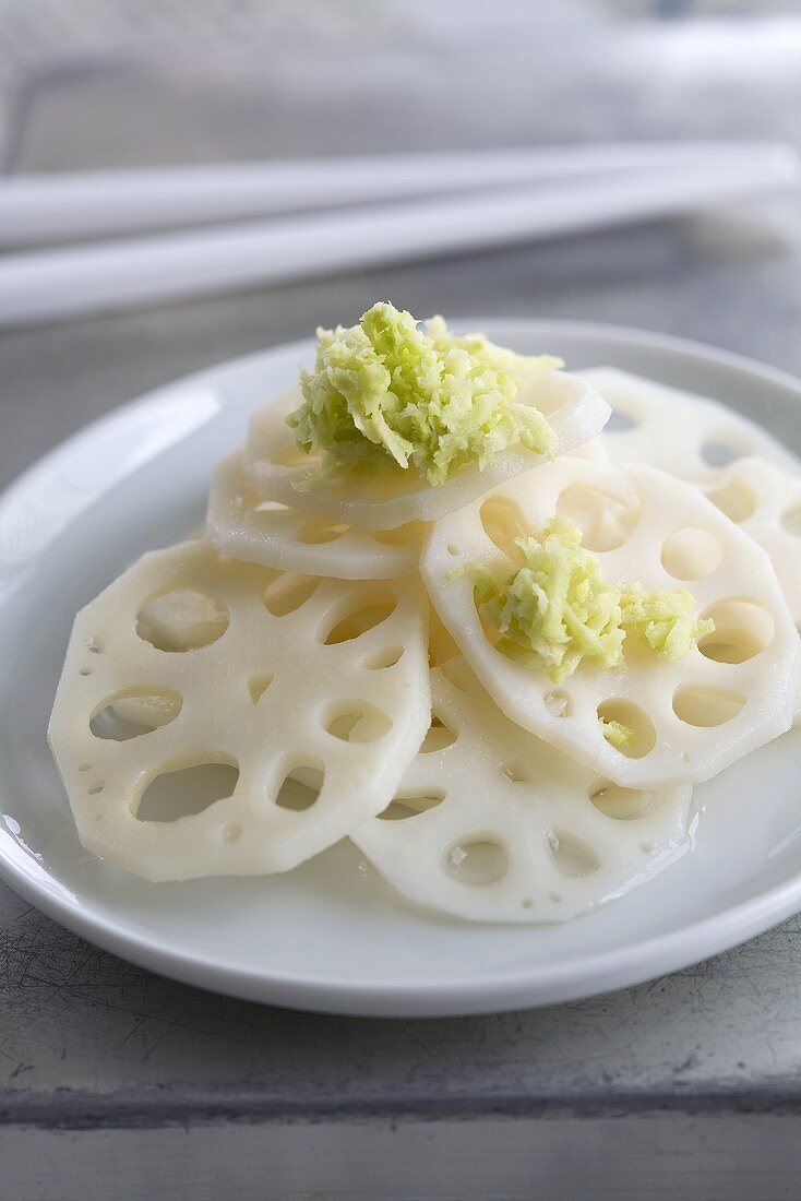 Slices of pickled lotus root with fresh wasabi